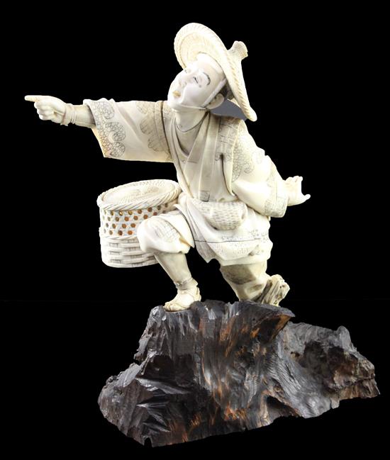 A Japanese sectional ivory figure of a fisherman, Meiji period, height 26.8cm, rod lacking